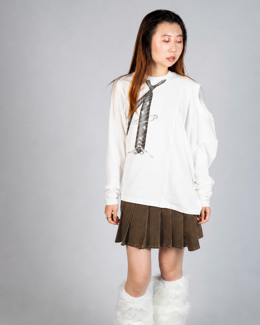 Model wearing MINASEONG washed brown asymmetric pleated mini skirt from AW26