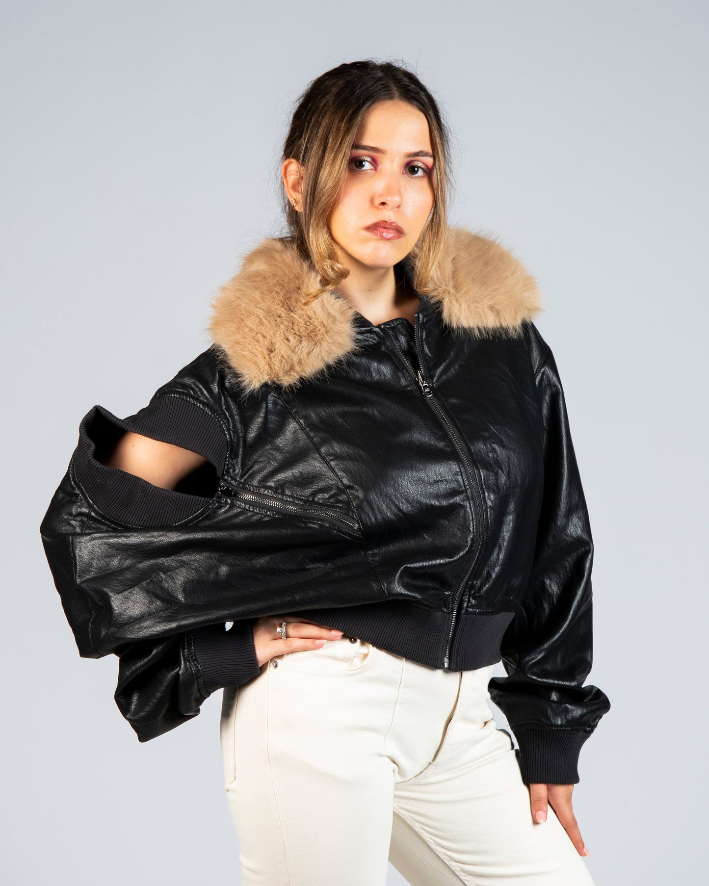 Front view of MINASEONG black faux leather bomber jacket with brown faux fur collar