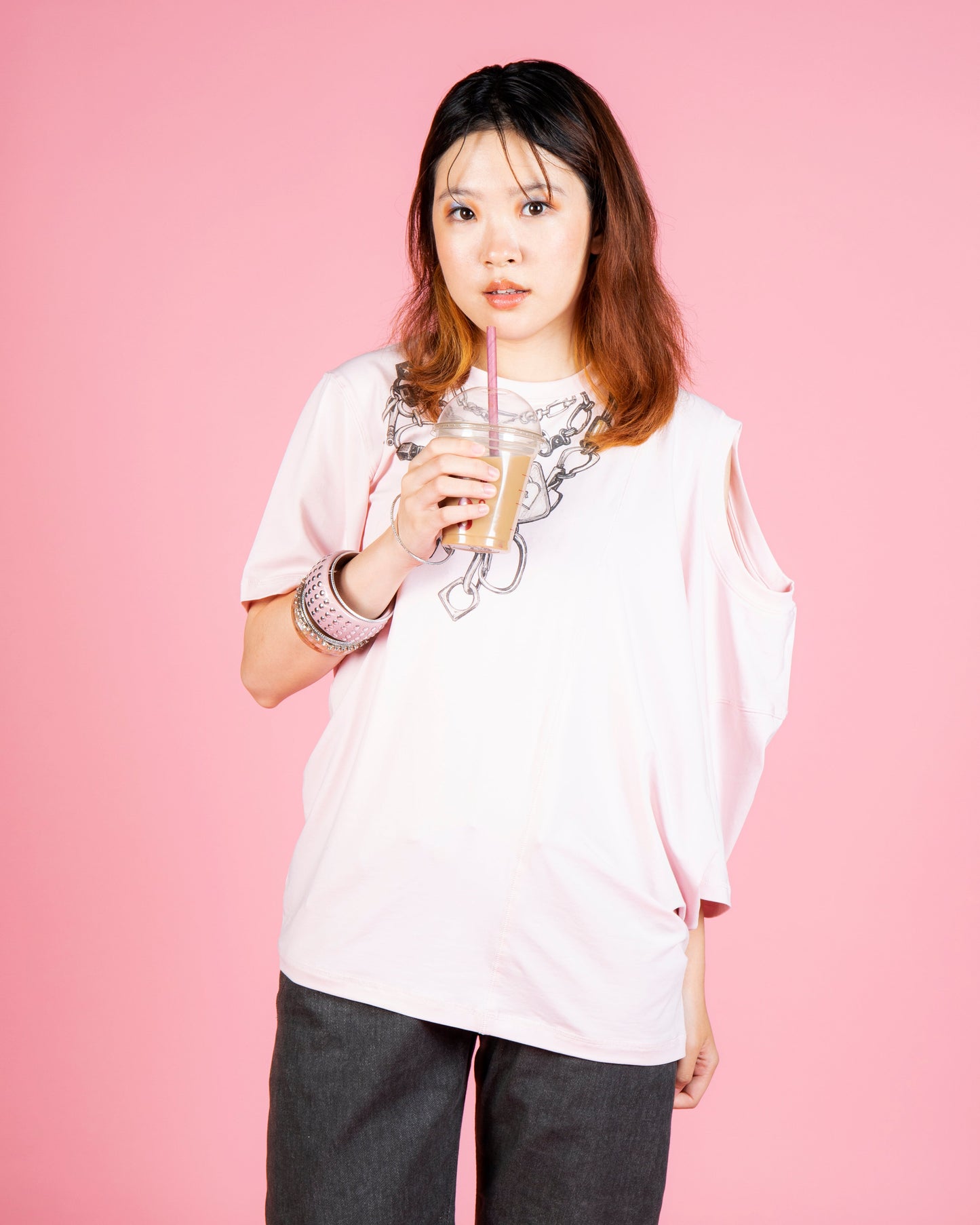 Model wearing MINASEONG baby pink dual-neck chain T-shirt from the AW26 collection