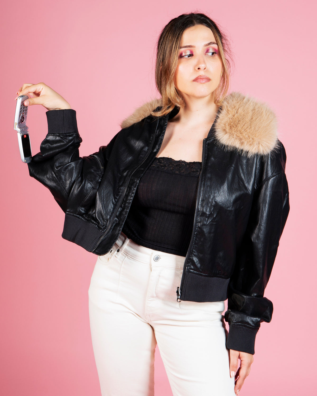 Model wearing MINASEONG black faux leather bomber jacket from the AW26 collection
