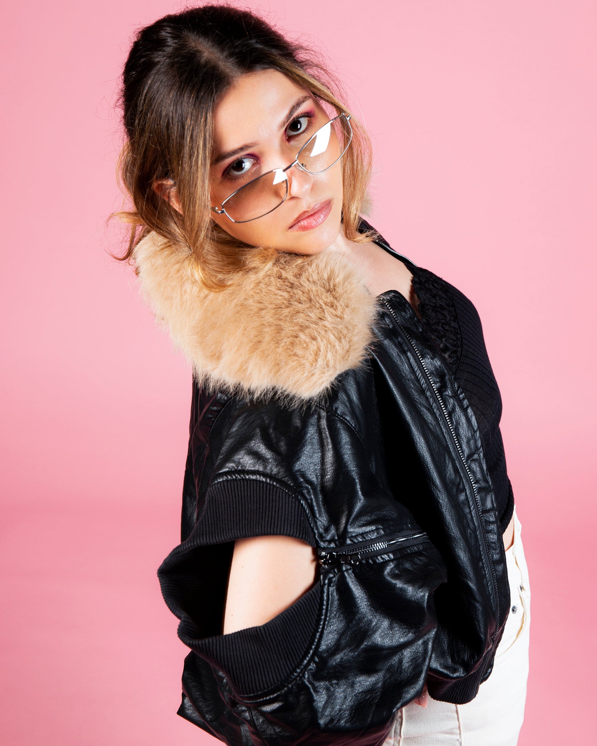 Model wearing MINASEONG black faux leather bomber jacket from AW26